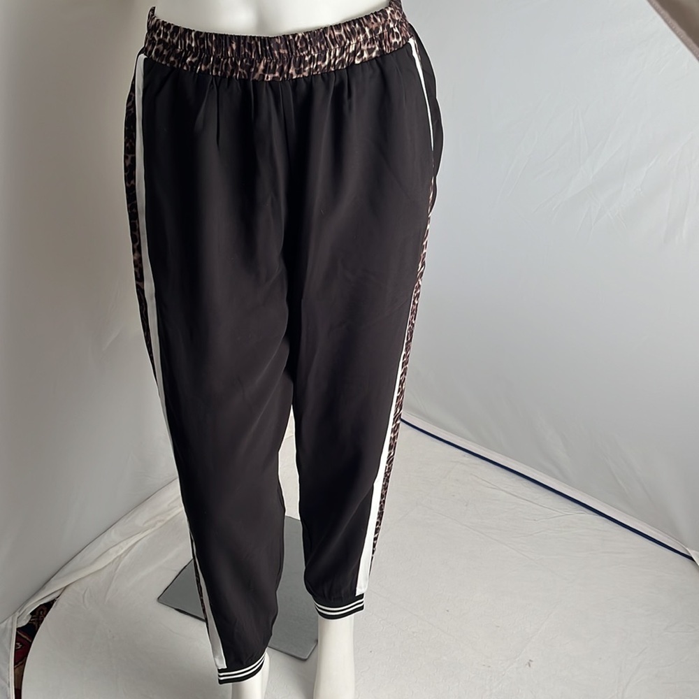 Dance and Marvel black jogger pants with multicolor leopard print and white trim